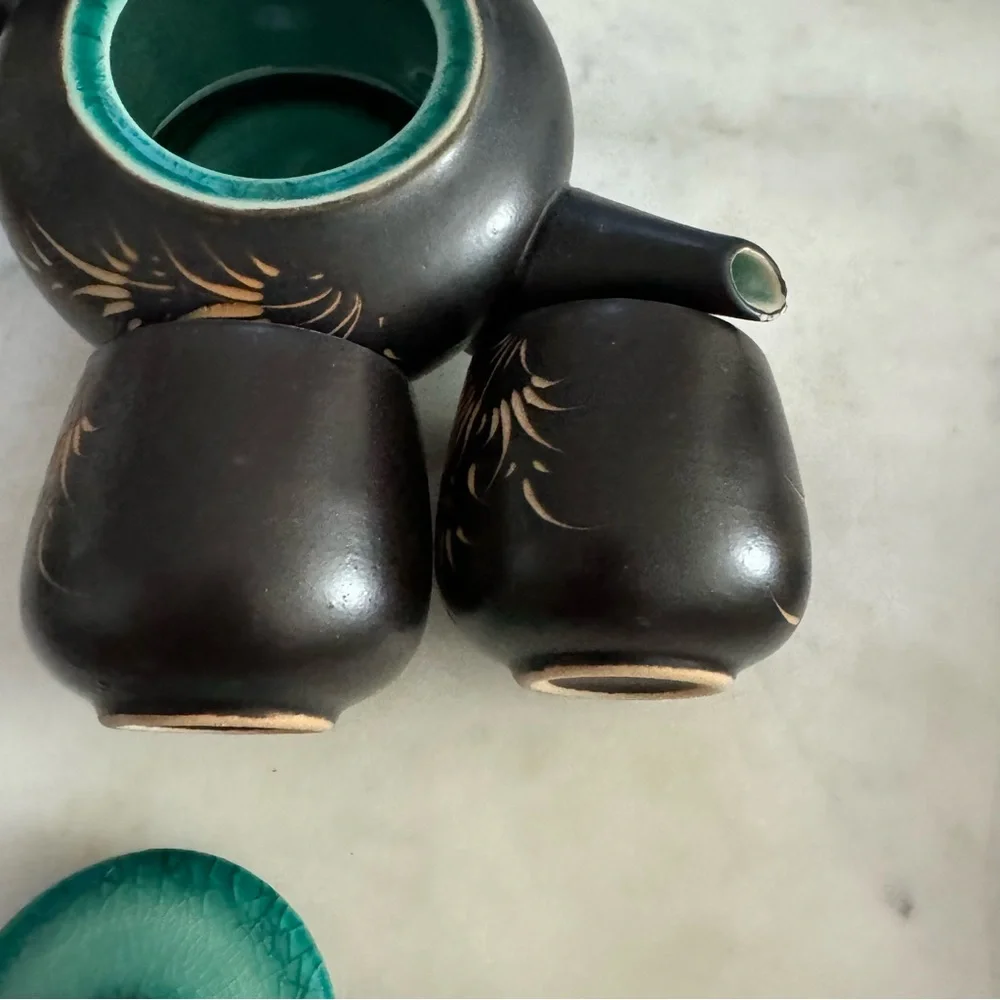 Carved Vietnamese tea kettle set with 2 small tea cups